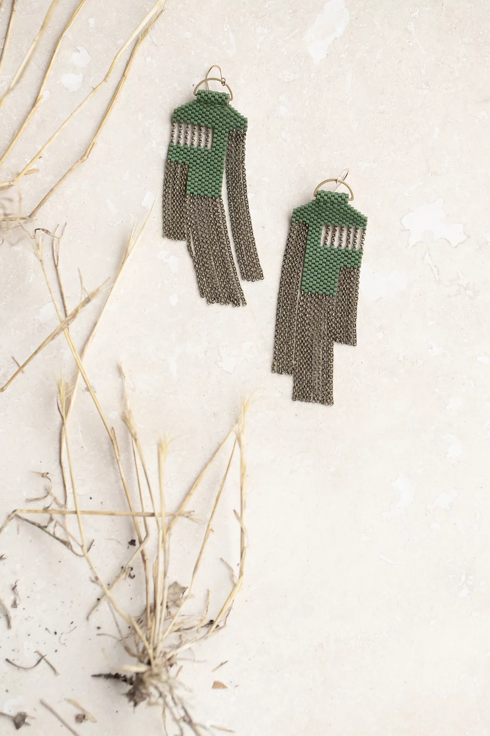 Moss green beaded statement earrings.