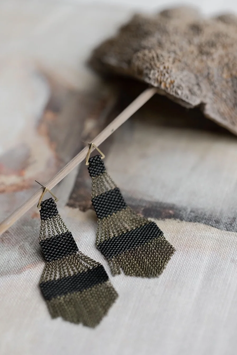 Pair of large black beaded chandelier shaped earrings.