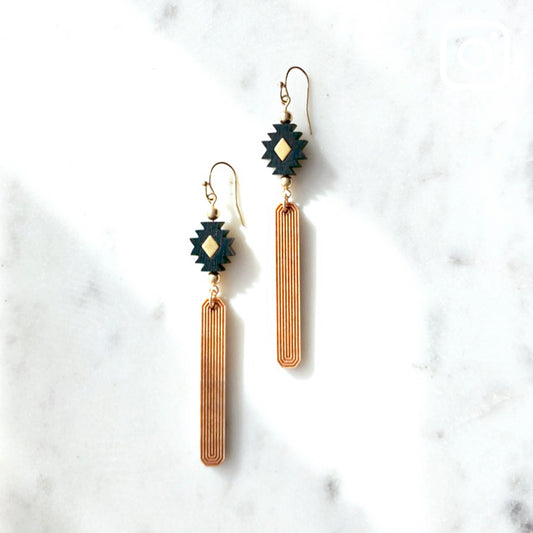 Black, gold and natural wood colored earrings made from laser carved wood.