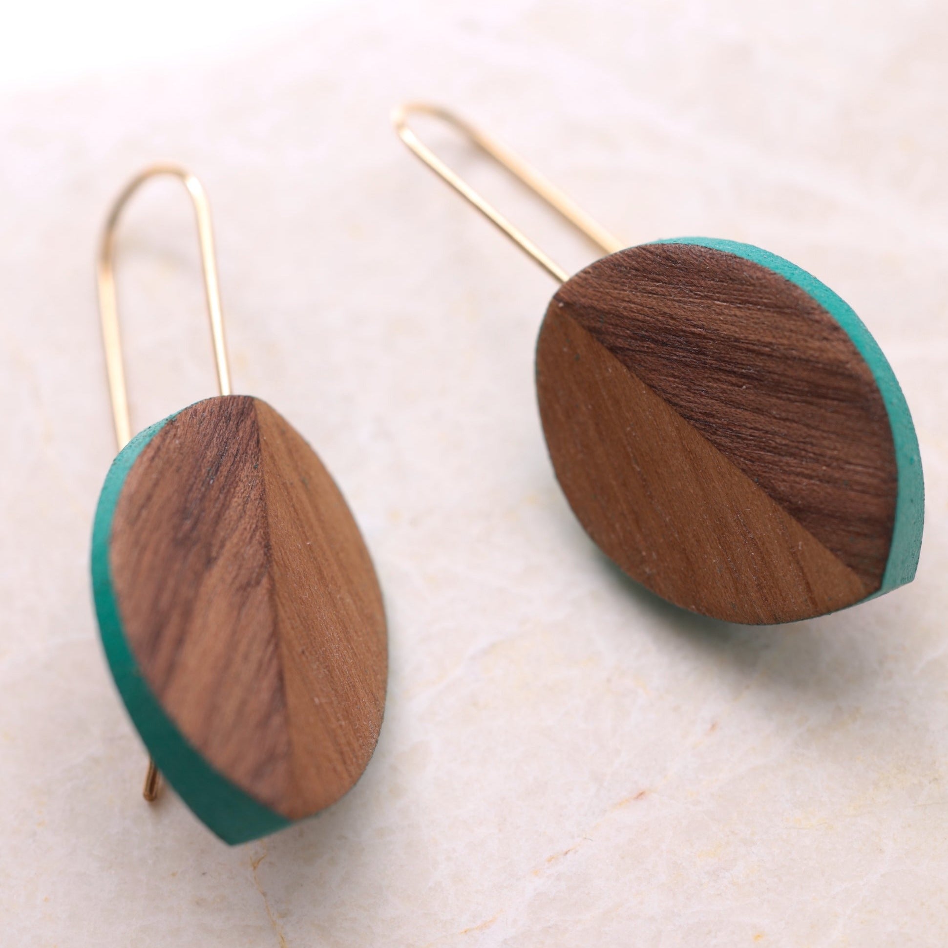 Leaf shaped wood carved earrings with turquoise accents, darker walnut wood.