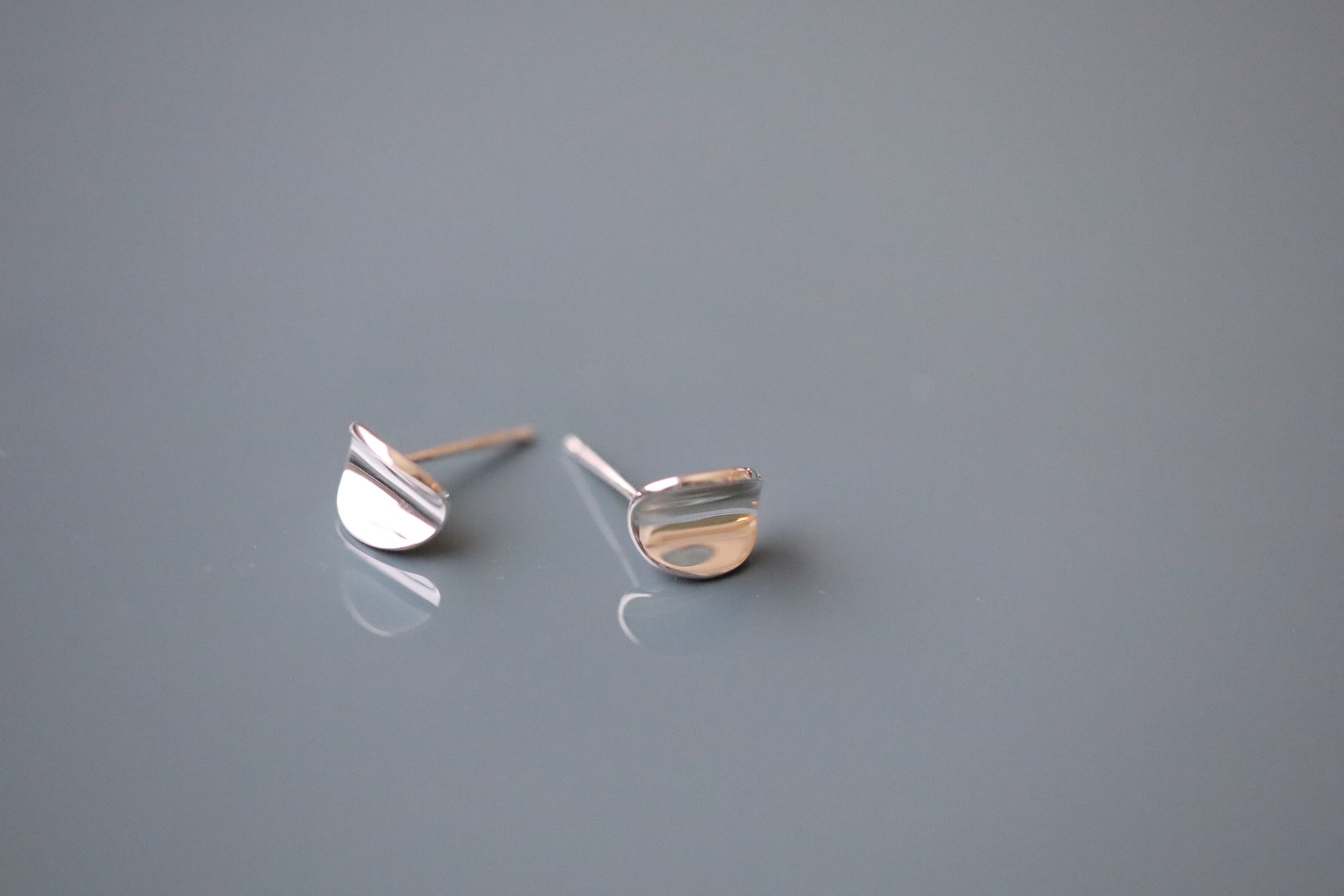 Curved organic shaped sterling silver earring studs.
