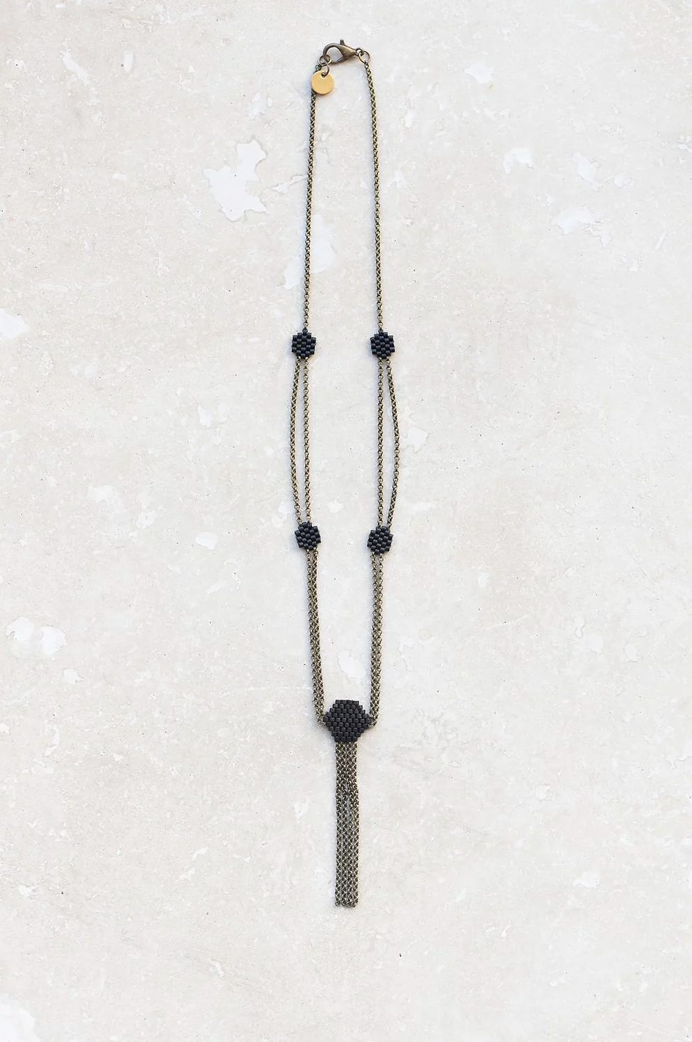 Delicate beaded chain necklaces in black.