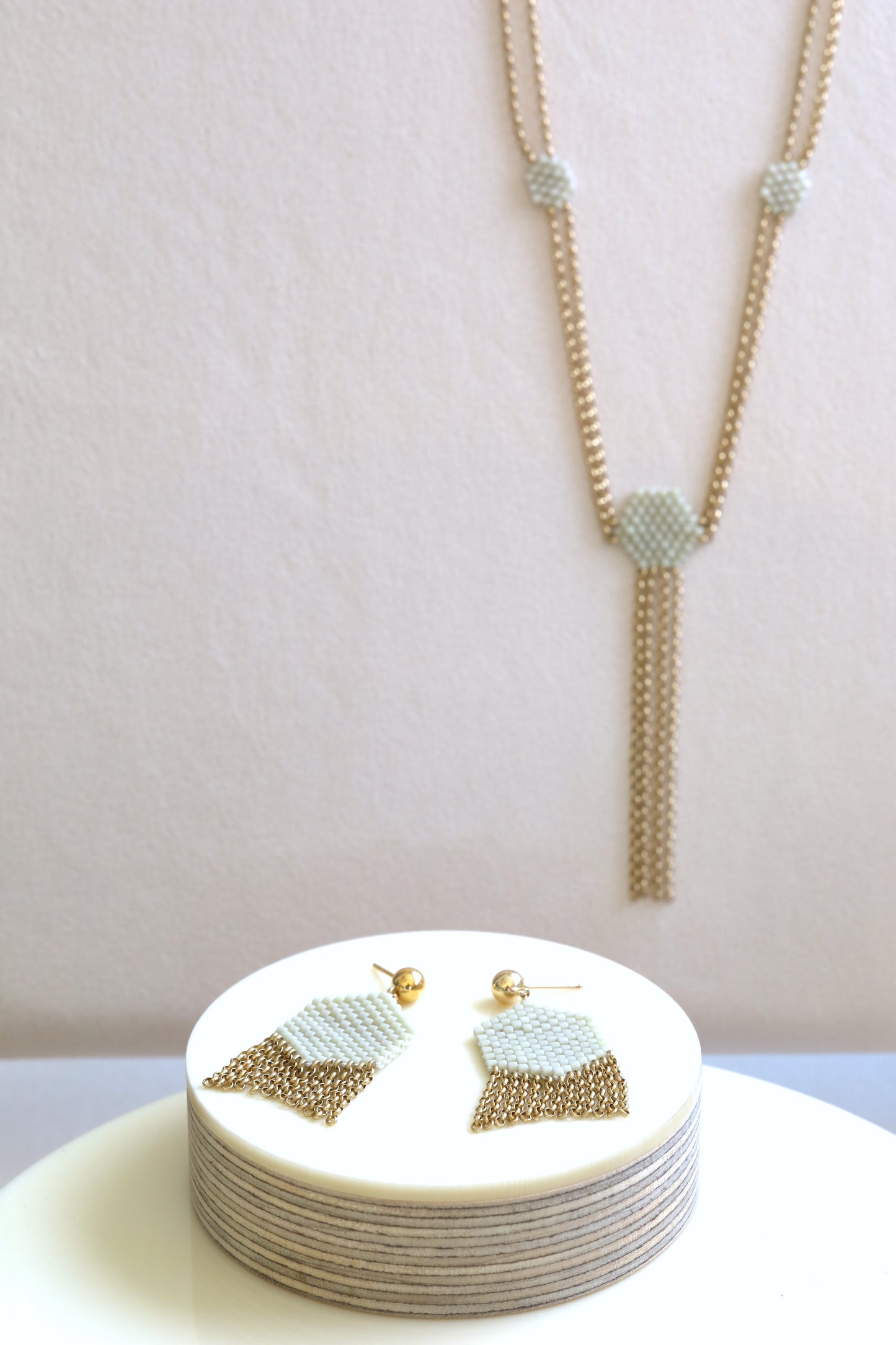Gold and off-white beaded earrings and necklace with 14k gold fill chain.
