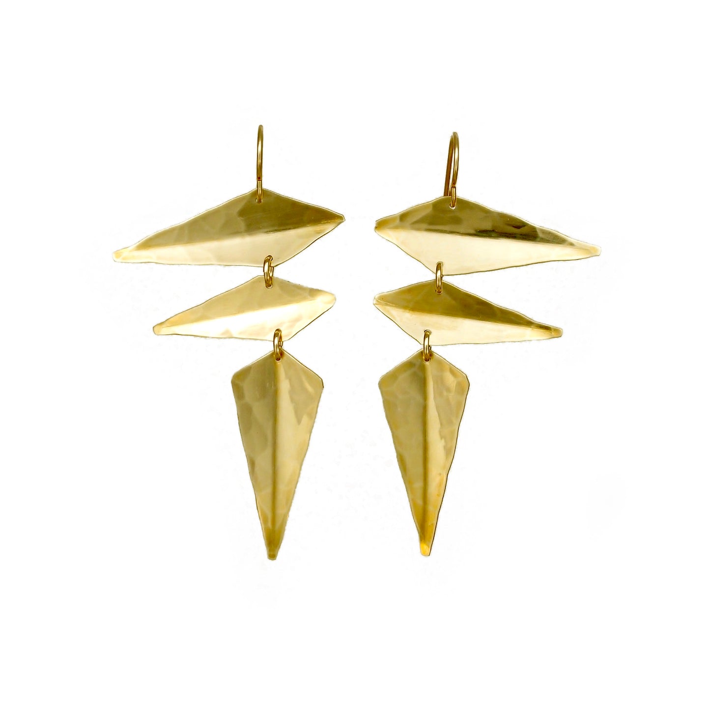 Gold earrings made from angular hammered metal shapes.
