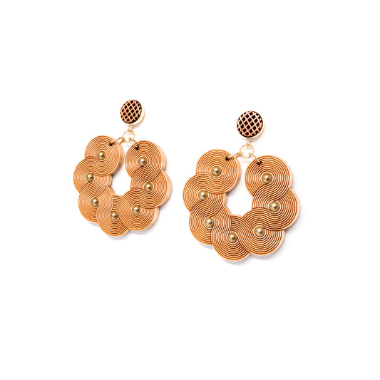 Laser carved wooden statement earrings tilted view